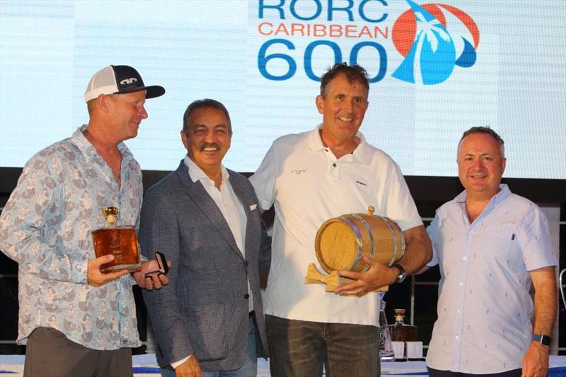 RORC Caribbean 600 - Hon. Charles 'Max' Fernandez presents Pete Cummins and Brian Thompson from Jason Carroll's MOD70 Argo with the Multihull Line Honours trophy - photo © Tim Wright / www.photoaction.com