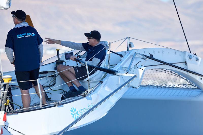 Brian Thompson at the helm of Frank Slootman's MOD70 Snowflake (USA), skippered by Gavin Brady in the 2023 RORC Transatlantic Race photo copyright James Mitchell / RORC taken at Royal Ocean Racing Club and featuring the MOD70 class