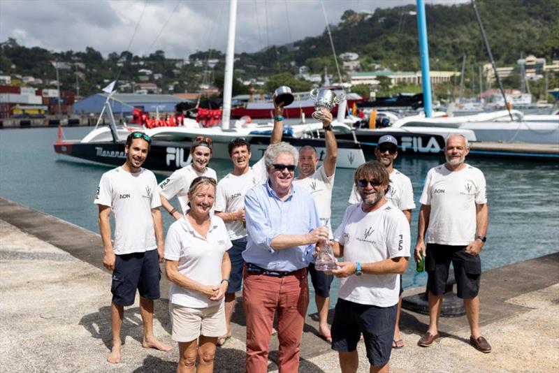 Andrew McIrvine presents Giovanni Soldini and team on Maserati Multi70 with the Multihull Line Honours trophy and keepsake in the RORC Transatlantic Race photo copyright Arthur Daniel / RORC taken at Royal Ocean Racing Club and featuring the MOD70 class