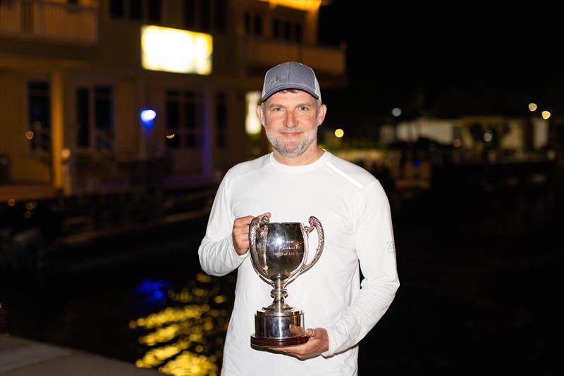 Jason Carroll with the Multihull Line Honours Trophy - photo © Arthur Daniel / RORC