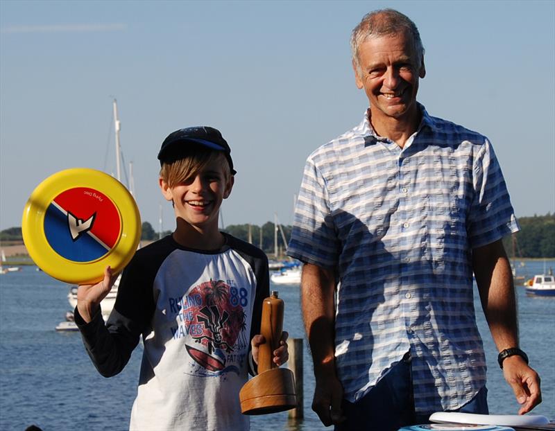 Oliver Stollery connecting trophy and prize from Commodore Ian Videlo during the 2018 Bottle Boat Championship at Waldringfield photo copyright Roger Stollery taken at Waldringfield Sailing Club and featuring the Model Yachting class