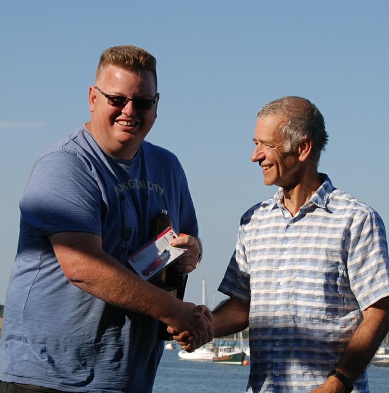 Matthew Lake receiving his trophy from Ian Videlo during the 2018 Bottle Boat Championship at Waldringfield photo copyright Roger Stollery taken at Waldringfield Sailing Club and featuring the Model Yachting class