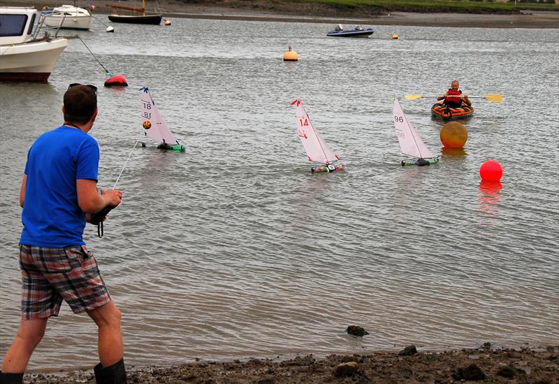 Bernard Kufluk looks on whilst his main rival  Graham Viney 96 wins to level the score during the 2019 Bottle Boat Championship at Waldringfield photo copyright Roger Stollery taken at Waldringfield Sailing Club and featuring the Model Yachting class