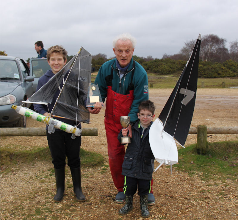 Winners Flynn Luxton (left, Seahorse Trophy) and James Nicholson (right, Setley Cup) together with PRO Stuart Jardine after the Junior Model Yachting near Lymington photo copyright Michael Derrick taken at  and featuring the Model Yachting class