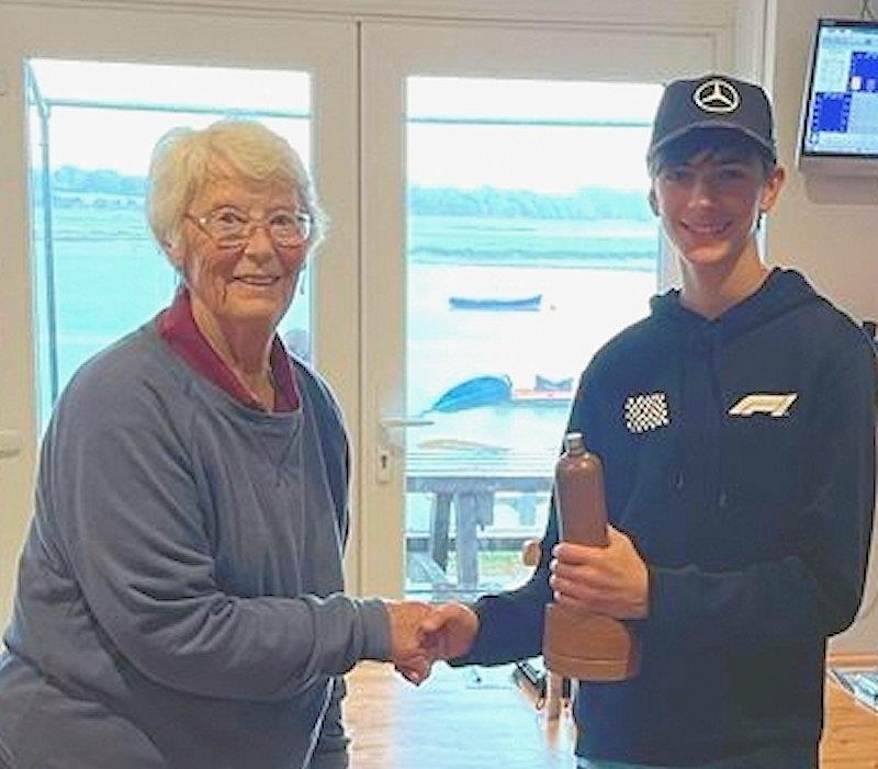 Margaret Lake (left) presenting one of the two special BOTTLE boat trophies to 13 year old Oliver Stollery who won both events photo copyright Peter Stollery taken at Waldringfield Sailing Club and featuring the Model Yachting class