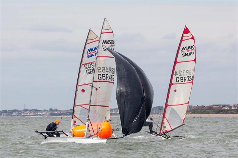 Musto Skiffs at Stokes Bay photo copyright Tim Olin / www.olinphoto.co.uk taken at Stokes Bay Sailing Club and featuring the Musto Skiff class