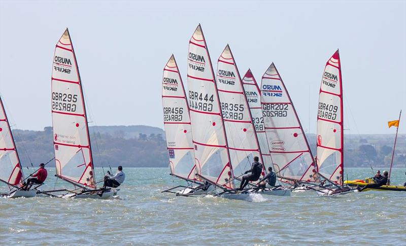 Musto Skiffs at Stokes Bay photo copyright Tim Olin / www.olinphoto.co.uk taken at Stokes Bay Sailing Club and featuring the Musto Skiff class