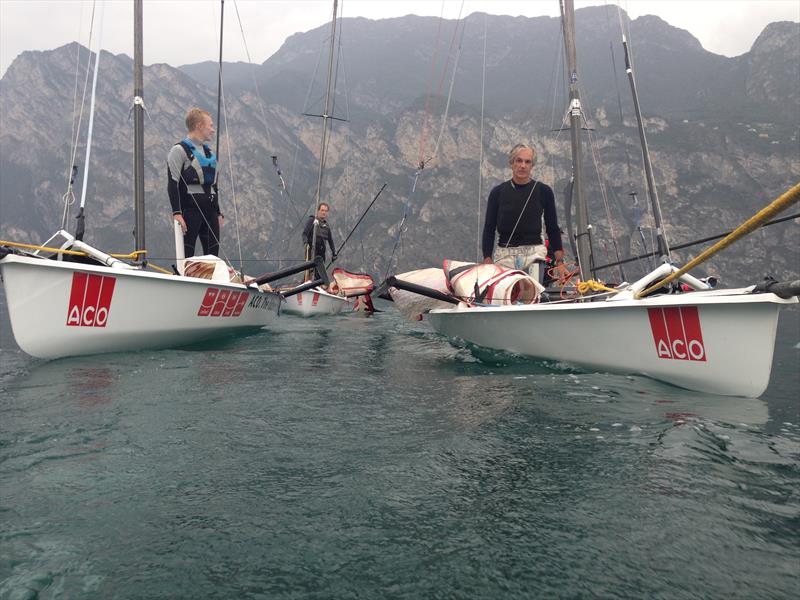 A tow-in on day 2 of the ACO Musto Skiff Pre-Worlds at Lake Garda photo copyright Rick Perkins taken at Fraglia Vela Riva and featuring the Musto Skiff class