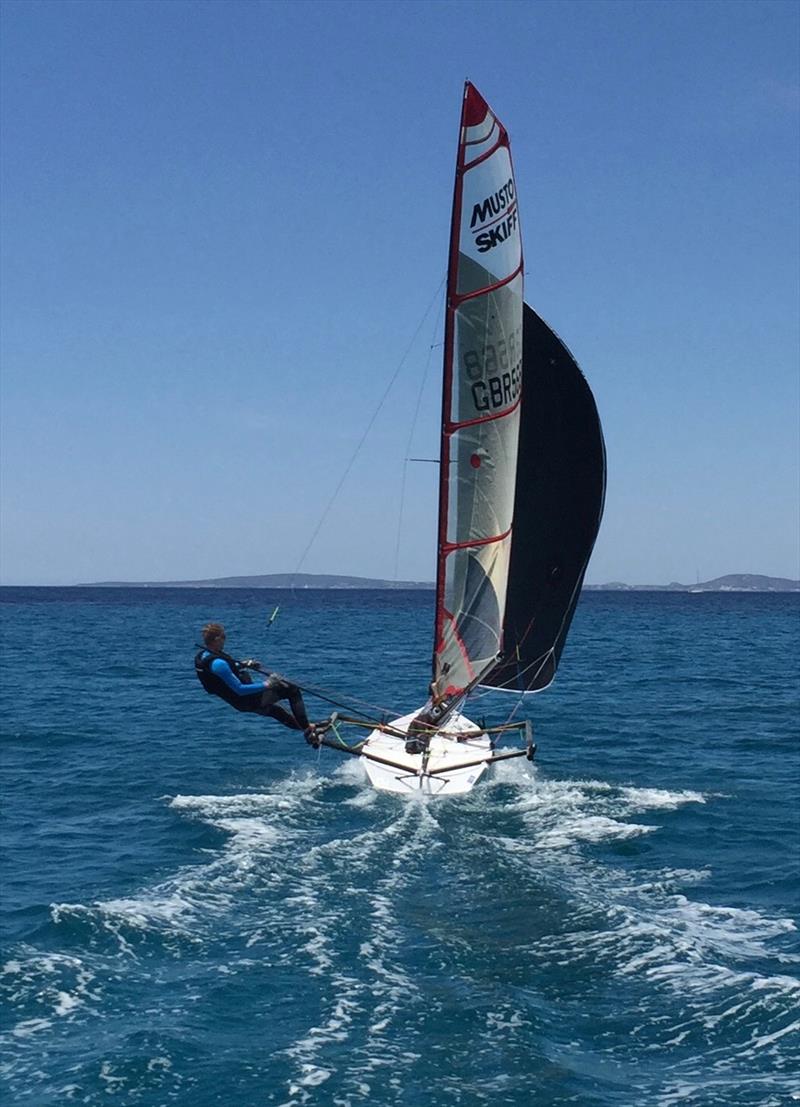 Champagne sailing downwind during the Musto Skiff Training in Palma photo copyright Russ Clark taken at Club Nàutic S'Arenal and featuring the Musto Skiff class