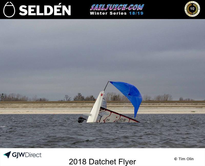 Musto Skiff capsized during the Datchet Flyer - Selden SailJuice Winter Series Round 2 photo copyright Tim Olin / www.olinphoto.co.uk taken at Datchet Water Sailing Club and featuring the Musto Skiff class