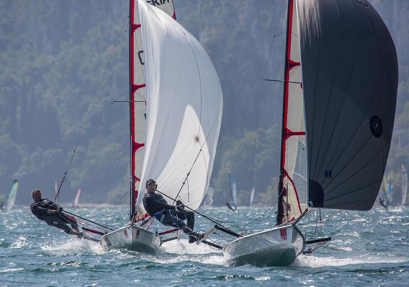 Action from the 2015 Musto Skiff Worlds at Lake Garda photo copyright Tim Olin / www.olinphoto.co.uk taken at Fraglia Vela Riva and featuring the Musto Skiff class