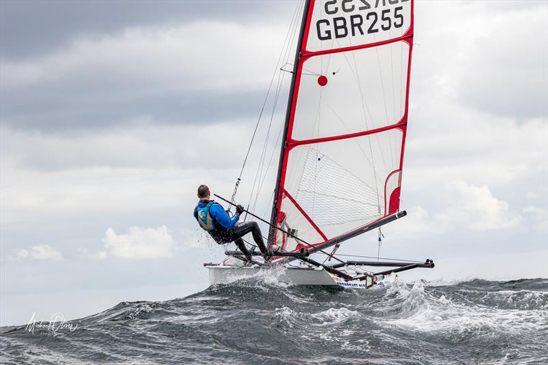 Andrew Scott over a big wave during the Noble Marine UK Musto Skiff National Championships at Sunderland photo copyright Michael Oliver taken at Sunderland Yacht Club and featuring the Musto Skiff class