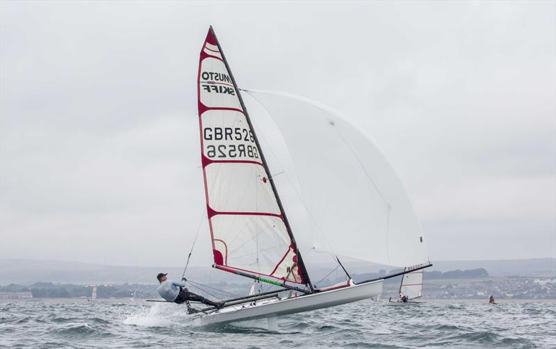 Jono Shelley in the Musto Skiff UK Nationals at Castle Cove SC photo copyright Tim Olin / www.olinphoto.co.uk taken at Castle Cove Sailing Club and featuring the Musto Skiff class