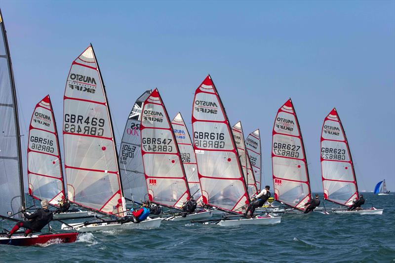 Startline action in the Musto Skiff class during the Stokes Bay Skiff Open photo copyright Tim Olin / www.olinphoto.co.uk taken at Stokes Bay Sailing Club and featuring the Musto Skiff class