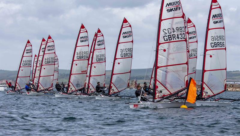 Musto Skiffs at the Weymouth Skiff Open 2022 photo copyright Tim Olin / www.olinphoto.co.uk taken at Weymouth & Portland Sailing Academy and featuring the Musto Skiff class