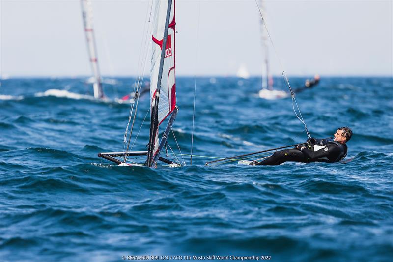 Josh Belben at the ACO 11th Musto Skiff World Championships 2022 photo copyright Bernardí Bibiloni / www.bernardibibiloni.com taken at Kieler Yacht Club and featuring the Musto Skiff class