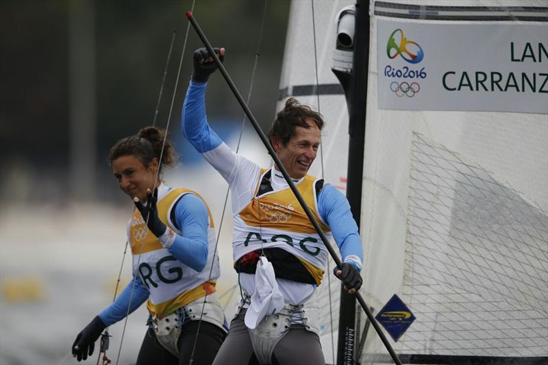 Santiago Lange celebrates with Cecilia Carranza Saroli after winning gold in the Nacra 17 class at the Rio 2016 Olympic Sailing Competition photo copyright Sailing Energy / World Sailing taken at  and featuring the Nacra 17 class