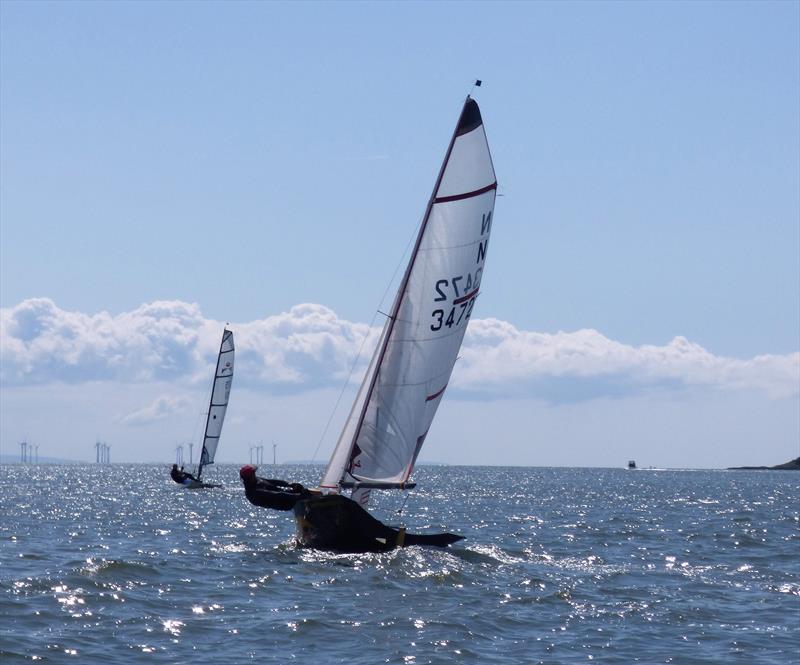 The National 12 of Mark and Anna Simpson chasing hard on the Vortex of Alex Glendinning in sparkling Solway during Kippford Week 2019 photo copyright Becky Davison taken at Solway Yacht Club and featuring the National 12 class