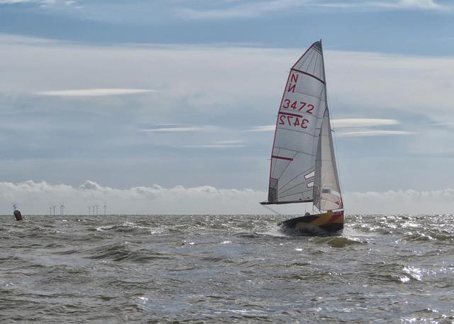 On the crest of a wave! Mark and Anna Simpson going flat out in the super fast boat on their way to winning the National 12 Scottish Championship 2019 during the Solway Yacht Club Championship weekend photo copyright John Sproat taken at Solway Yacht Club and featuring the National 12 class