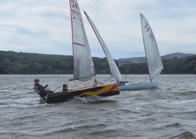 National 12 meets Finn: Mark and Anna Simpson in close company with Stewart Mitchell's Finn during the Solway Yacht Club Championship weekend photo copyright John Sproat taken at Solway Yacht Club and featuring the National 12 class