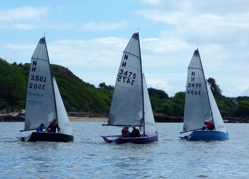 Close racing in the National 12 Scottish Championship; Philip David and Emma Hampshire lead Patrick Hamilton and Gayle Kaye with Tim and Christopher Hampshire giving chase during the Solway Yacht Club June Open photo copyright Becky Davison taken at Solway Yacht Club and featuring the National 12 class
