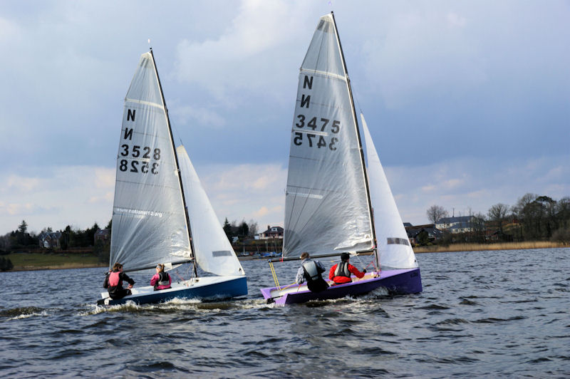 Richard Harvey and Crawford Paris in N3475 duelling with Nick and Tania Copsey in N3528 during the National 12 Scottish Championships photo copyright Alan Sharples taken at Annandale Sailing Club and featuring the National 12 class