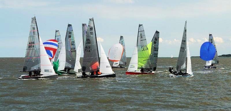 Action at the leeward mark, Two And Half Men leads from Second Wife, in the National 18 British and Irish Championships at West Mersea - photo © Carolyne Vines