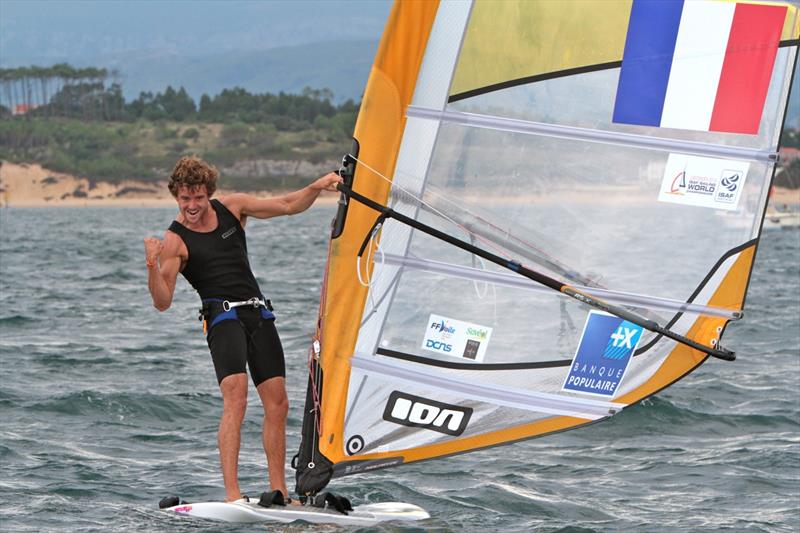 Pierre Le Coq celebrates a win on day 5 of the ISAF Sailing World Championship photo copyright Vincenzo Baglione taken at  and featuring the RS:X class