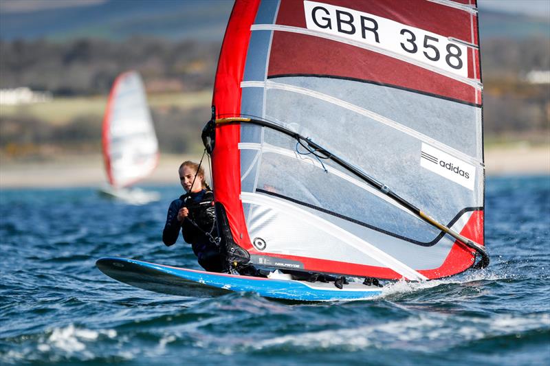 Lily Young on day 2 of the RYA Youth National Championships photo copyright Paul Wyeth / RYA taken at Plas Heli Welsh National Sailing Academy and featuring the RS:X class