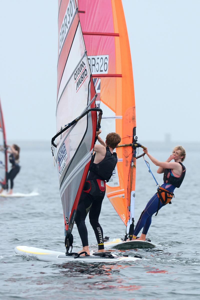 Isaac Lines (sail number 301)/Erin Watson (sail number 526) in action at day one of the RS:X Youth Nationals, plus fleet shots photo copyright Rick Tomlinson / RYA taken at Weymouth & Portland Sailing Academy and featuring the RS:X class