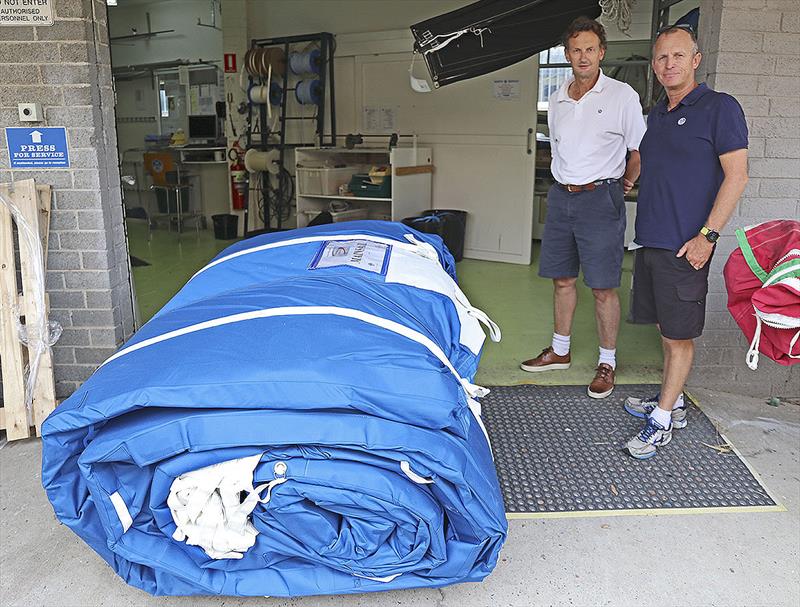 Fresh delivery! Michael Coxon and Alby Pratt inspect the new 3Di Mainsail for the supermaxi, Scallywag. - photo © John Curnow