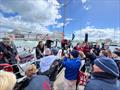 Ecstatic Maiden fans gather in sunny Cowes to welcome the UK entrant home on the completion of her final circumnavigation after 218 days racing around the world © Don McIntyre / OGR2023
