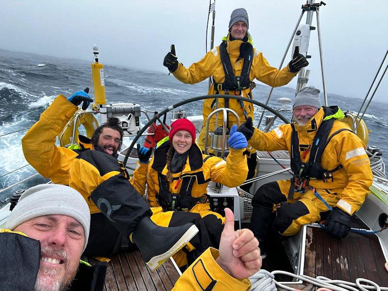Still smiling despite the broken vang and spinnaker wrap, but they have experience with spinnaker issues having blown out a 40-year-old spinnaker at the finish line in Cape Town. Maybe keeping hands on the helm would help?  - photo © Team Outlaw / OGR