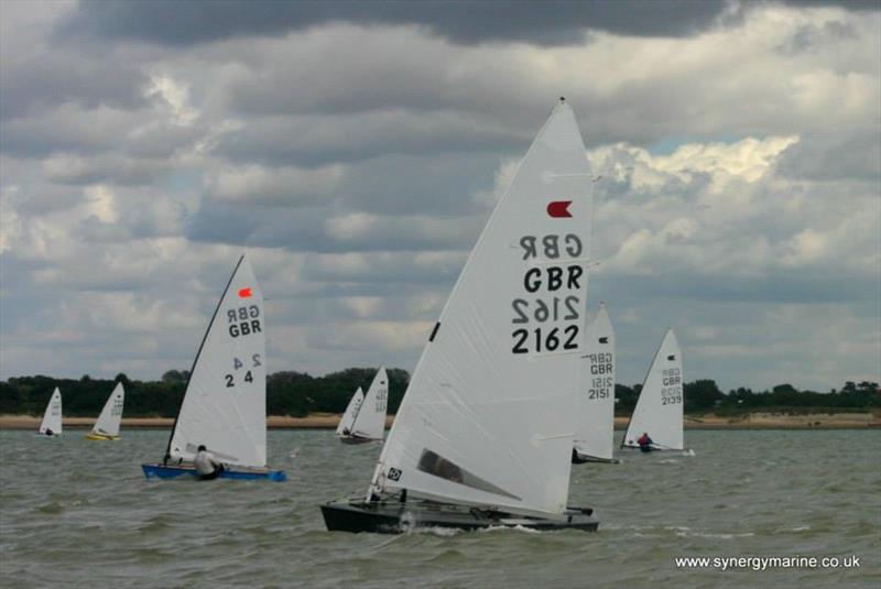 Hunt leveraging the fleet during the International OK Dinghy UK Nationals at Dabchicks day 4 photo copyright Simon Cox / www.synergymarine.co.uk taken at Dabchicks Sailing Club and featuring the OK class