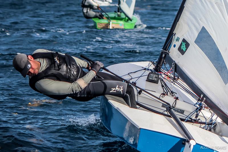 Mark Jackson checking for weed on day 2 of the 2017 OK Dinghy Worlds photo copyright Alastair Deaves taken at Barbados Yacht Club and featuring the OK class