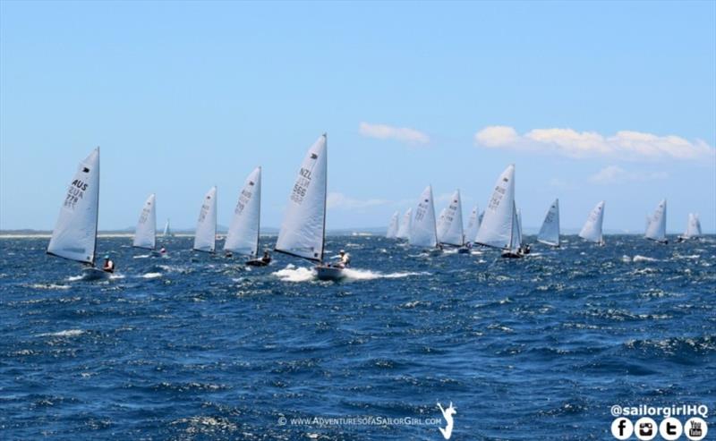 A fleet of 42 OK Dinghies competing in the International OK Dinghy Australian Championships final day offshore the beautiful Gold Coast photo copyright Nic Douglass / www.AdventuresofaSailorGirl.com taken at  and featuring the OK class