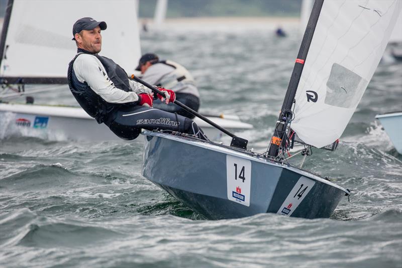Jens Lauge on day 2 of the OK Dinghy World Championship photo copyright Robert Deaves taken at  and featuring the OK class