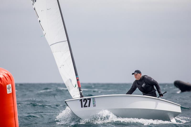 OK Dinghy Worlds Day 2 - Niklas Edler, SWE photo copyright Robert Deaves / www.robertdeaves.uk taken at Lyme Regis Sailing Club and featuring the OK class