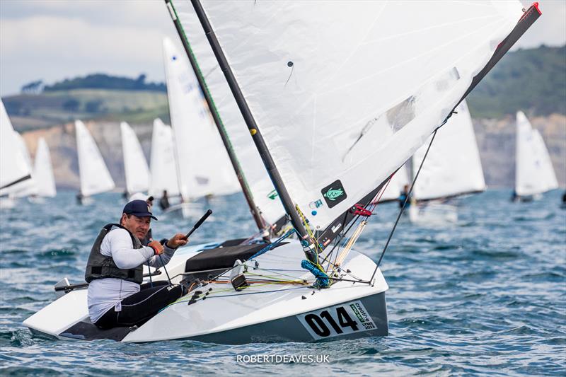 OK Dinghy Worlds Day 4 - Roger Blasse, AUS photo copyright Robert Deaves / www.robertdeaves.uk taken at Lyme Regis Sailing Club and featuring the OK class