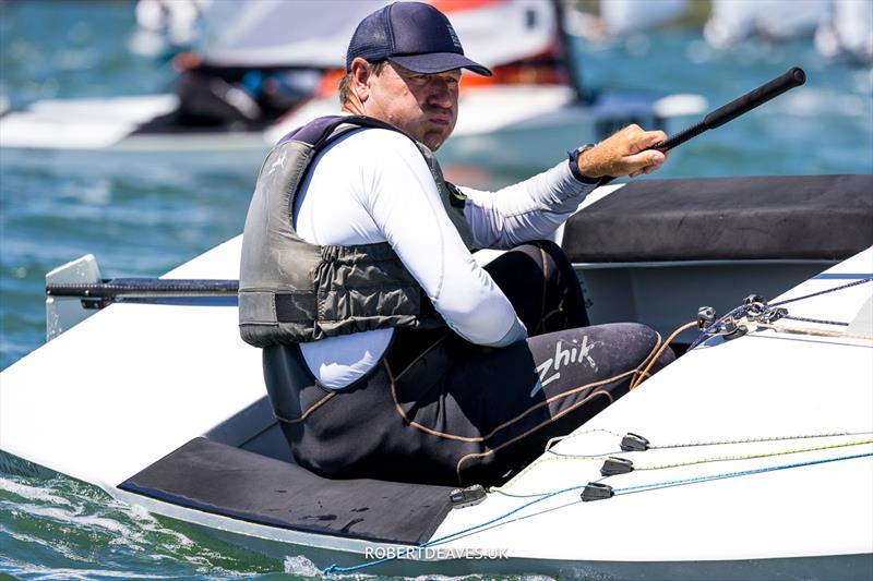 Roger Blasse, AUS on day 4 of the 2024 OK Dinghy World Championship Brisbane photo copyright Robert Deaves / www.robertdeaves.uk taken at Royal Queensland Yacht Squadron and featuring the OK class