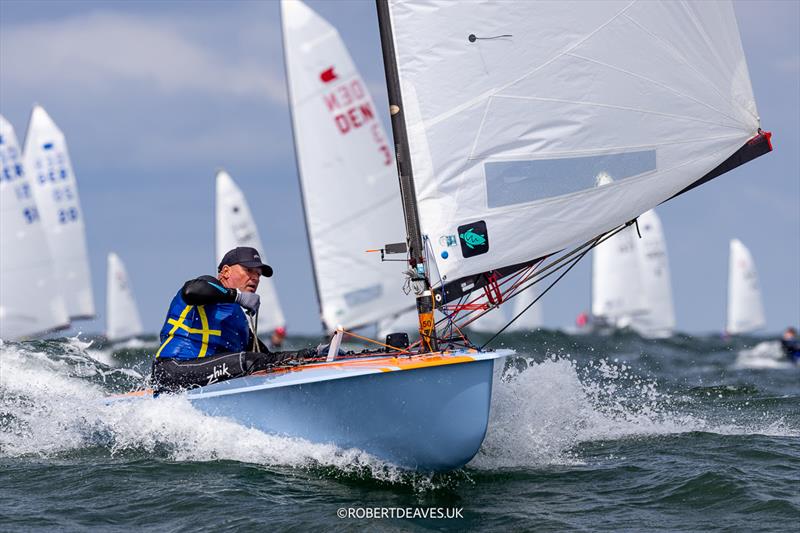 Patric Mure, SWE on day 3 of the OK Dinghy Europeans at Warnemünde photo copyright Robert Deaves / www.robertdeaves.uk taken at Warnemünder Segel-Club and featuring the OK class