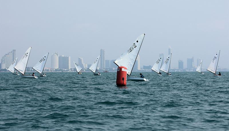 OK fleet downwind on day 2 of the Open Masters Championship 2026 photo copyright Henry Weidmann taken at Royal Varuna Yacht Club and featuring the OK class
