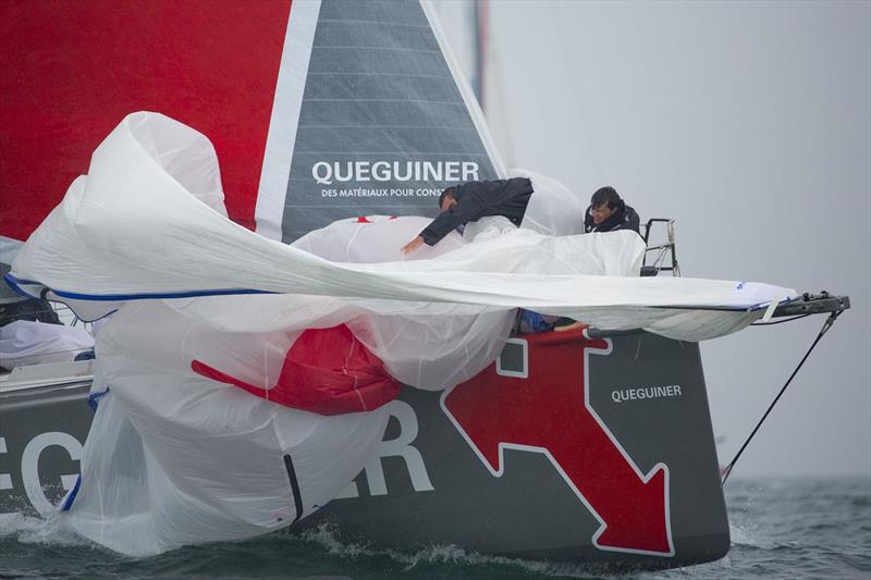 The crew of Groupe Quéguiner pull the kite in during a race on the Artemis Challenge photo copyright Mark Lloyd / www.lloyd-images.com taken at Cowes Combined Clubs and featuring the IMOCA class