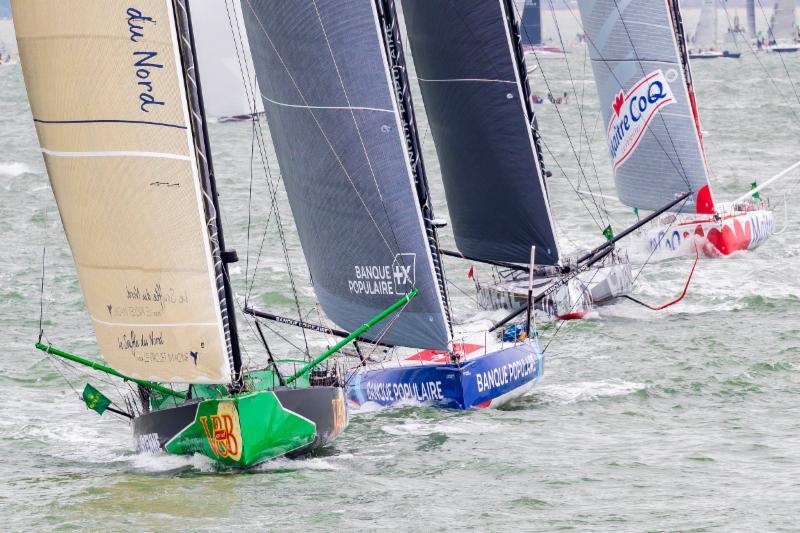 Twenty IMOCA 60s at the start of the Rolex Fastnet Race - photo © Rolex / Carlo Borlenghi