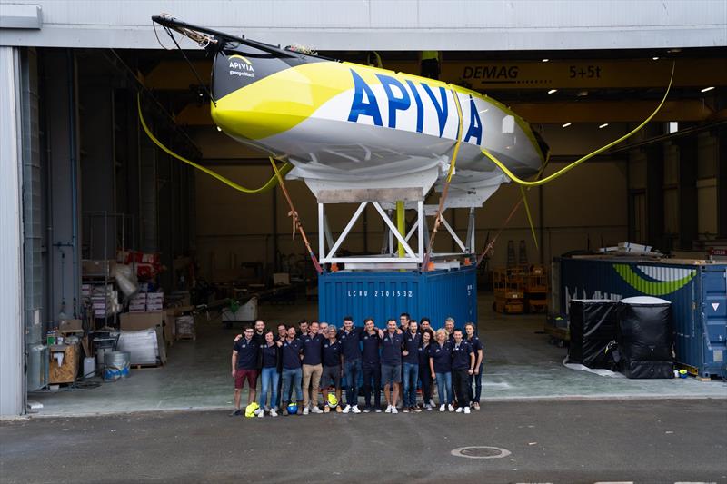 The Apivia Voile design, build, support and sailing team with their creation/new charge  at her launch in Lorient, France, August 2019 photo copyright Maxime Horlaville taken at  and featuring the IMOCA class