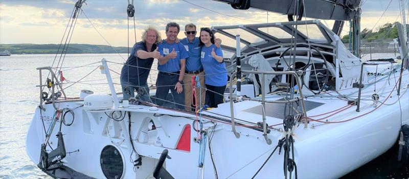 Stoke Mandeville Spinal Research Chairman, Richard Tolkien, and his three-man crew including Bronwen Maddox, Frank Sturm and David Herrod photo copyright Sam Heggie taken at  and featuring the IMOCA class