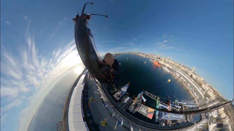 Fred Buyle climbs 90ft mast of 11th Hour Racing Team's boat 'Malama' - photo © Fred Buyle