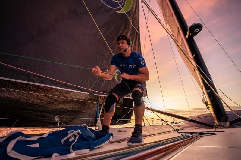 25 January 2023, Leg 2 onboard Holcim - PRB Team. Tom Laperche assists an unfurl on the bow of Team Holcim - PRB photo copyright Georgia Schofield / polaRYSE / Holcim - PRB taken at  and featuring the IMOCA class