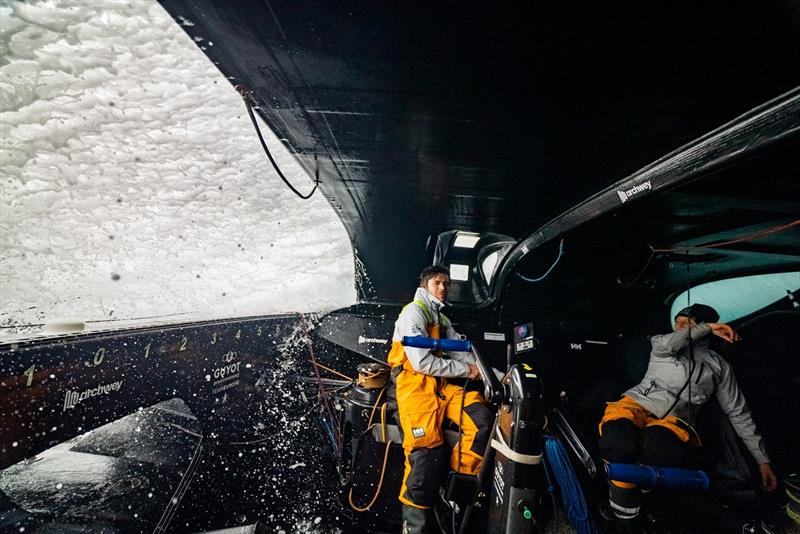 9 February , Leg 2, day 16 onboard GUYOT environnement - Team Europe. Sebastien Simon and Anne-Claire le Berre in the cockpit as a wave covers the boat - photo © Charles Drapeau / Guyot-environnement - Team Europe