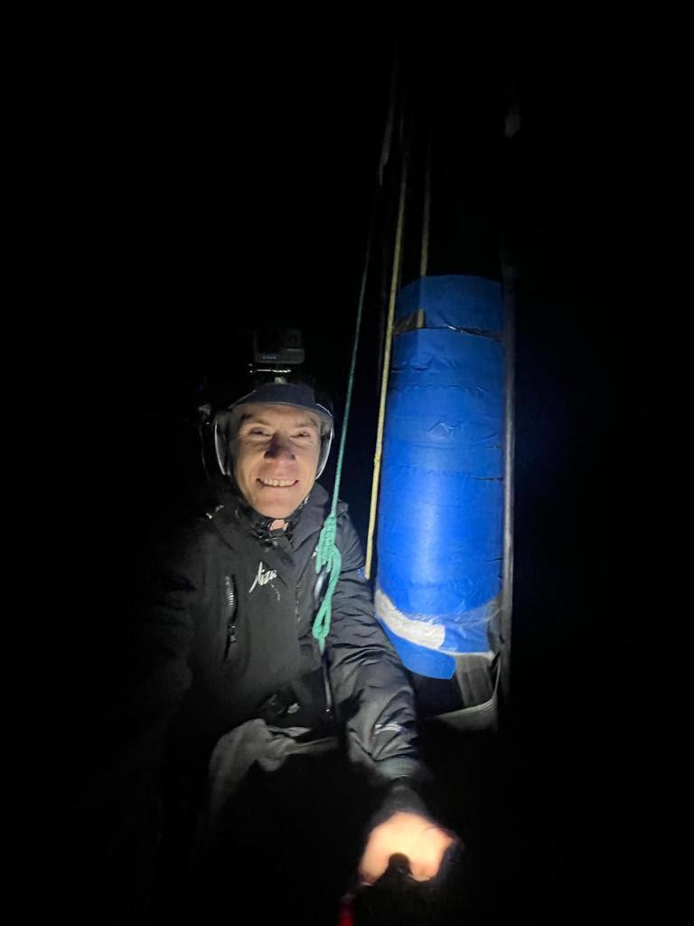 Will Harris finishing mast repair in the dark photo copyright Team Malizia taken at  and featuring the IMOCA class